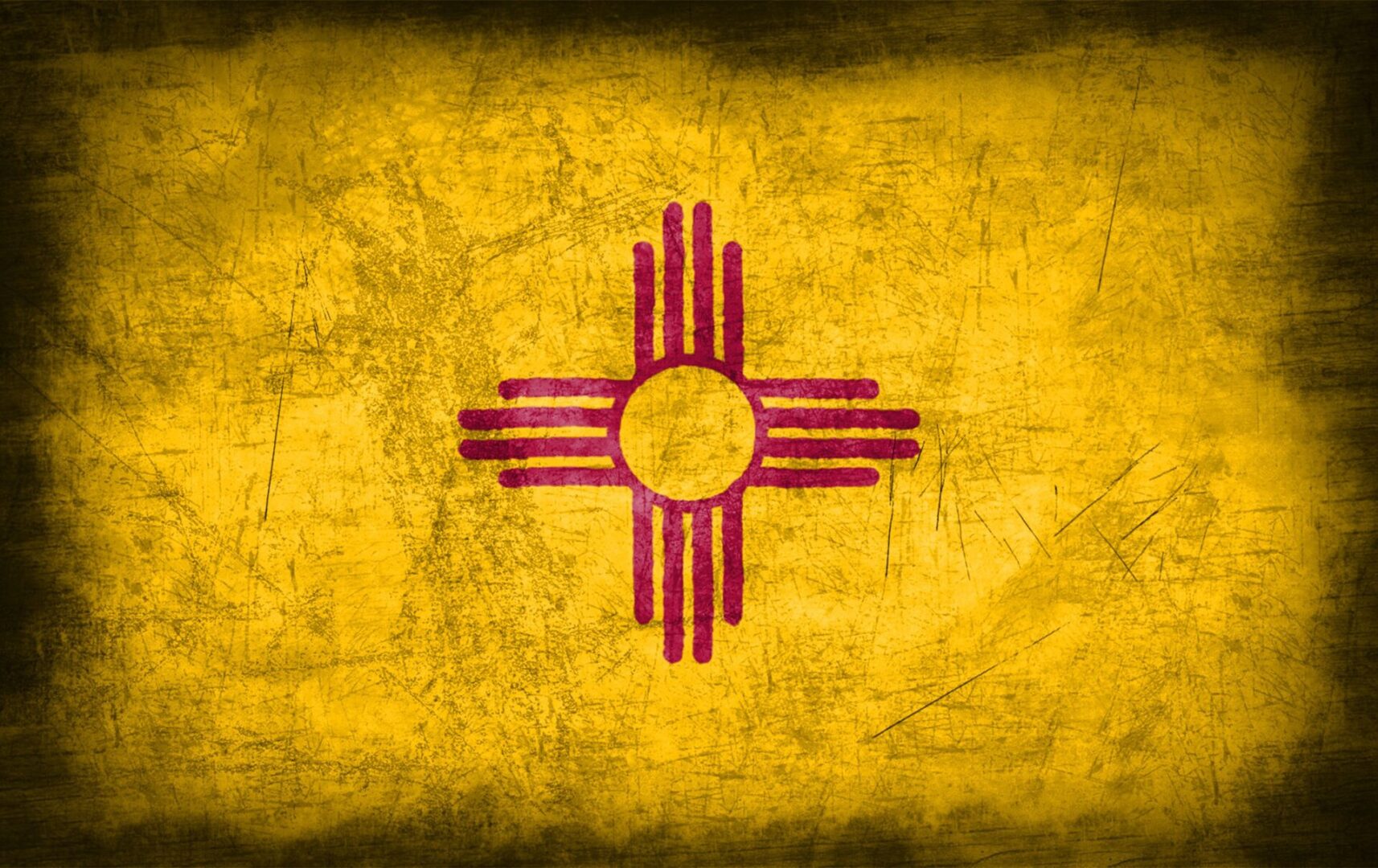 A flag of new mexico painted on a wall.