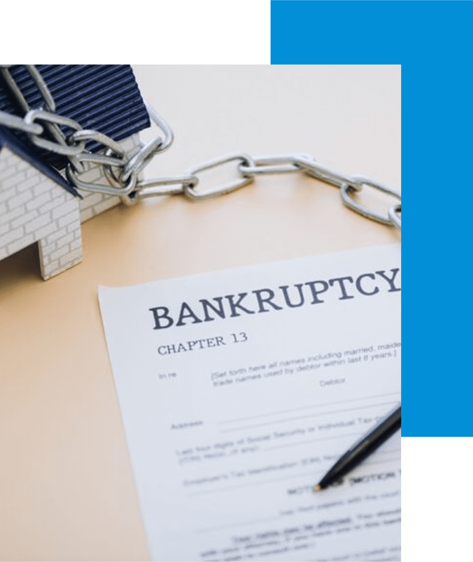 Bankruptcy document beside chained house model.